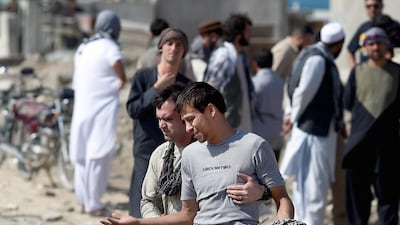 An Afghan man cries as he search for his relatives near Camp Integrity, a base housing US special forces that was attacked by militants, in Kabul on August 8, 2015. The attack resulted in the death of one NATO service member whose nationality was not revealed. Multiple bombings rocked Kabul on August 7, killing at least 36 people and wounding hundreds more in the deadliest day in the Afghan capital since the end of the NATO combat mission in December. AFP PHOTO/WAKIL KOHSAR
