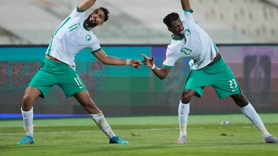 Saudi Arabia's Abdullah Alkhainari, left, and Mohammed Kanno celebrate Saleh Al Shehri's opening goal. AP
