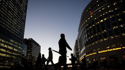 Commuters at night in London. Optimism in the economy also rose at a similar pace following a dip in July when many firm were struggling with staff shortages . Bloomberg