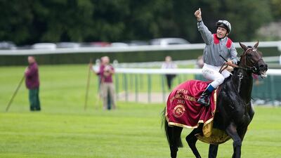 Jockey Thierry Jarnet celebrates on Treve after winning the Prix de l’Arc de Triomphe in front of 52,000 racegoers that crammed into Longchamp in Paris on Sunday. Ian Langsdon / EPA
