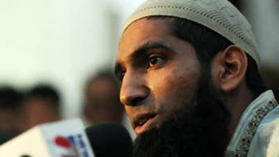 The banned Pakistani cricketer Mohammad Yousuf speaks to media representatives during a news conference in Karachi today as he returns from India after playing in the unsanctioned Indian Cricket League.