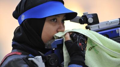 Malaysia's Nur Ayuni Farhana Abdul Halim, who won the Commonwealth Games gold medal with Nur Suryani Taibi in the 10-metre air rifle pairs in New Delhi four years ago, was left devastated by her team’s decision after the garment failed to turn up in time for Monday’s registration. AFP PHOTO / Bay ISMOYO
