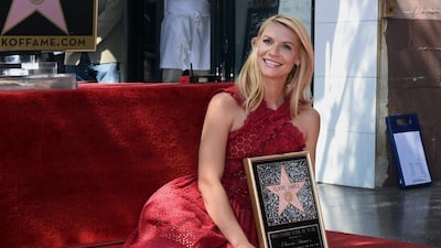 Claire Danes poses with her star on the Hollywood Walk of Fame. EPA / PAUL BUCK