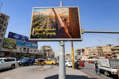 A billboard carrying the slogan 'reclaiming the decision and building the home', referring to the scheduled US military withdrawal from Iraq, in central Baghdad. AFP
