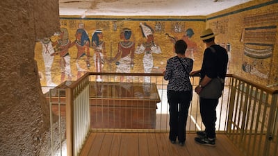 Tourists look at the golden sarcophagus of Pharaoh Tutankhamun displayed at his burial chamber in his underground tomb in the Valley of the Kings in Egypt. AFP