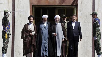 Leaders of Iran send off President Hassan Rouhani, centre right, at the Mehrabad airport in Tehran, Iran, where Mr Rouhani is due to attend the United Nations General Assembly in New York on September 22, 2014. Vahid Salemi/AP Photo