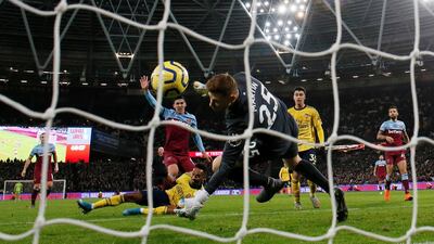 Arsenal's Pierre-Emerick Aubameyang scores their third goal. Reuters