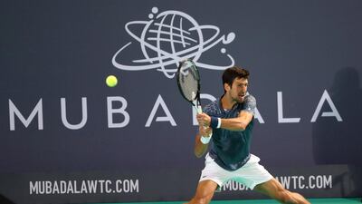 Novak Djokovic returns a shot against Karen Khachanov during their Mubadala World Tennis Championship match at Zayed Sports City. Reuters