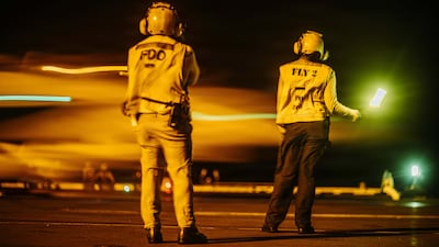 US sailors conduct night flight operations aboard USS George Washington (CVN 73) as the ship sails in regional waters supporting operations in the Middle East. Photo: Centcom