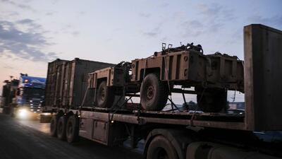 A convoy of U.S. armored military vehicles leave Syria on a road to Iraq. Getty Images