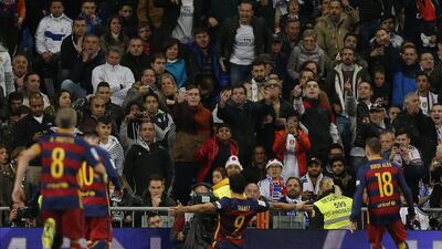Barcelona’s Luis Suarez celebrates after scoring the opening goal against AS Roma on Tuesday night in the Champions League. Daniel Ochoa de Olza / AP