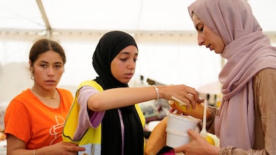 Volunteers from Luna Blanca NGO distribute food in Ceuta. Reuters