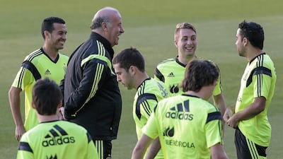 Spanish head coach Vicente del Bosque, in black, named his squad for the World Cup on Saturday May 31. EPA/JULIO MUNOZ