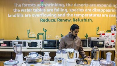 An employee arranges refurbished kitchen goods on display inside a store of GreenDust in the Neb Serai area of New Delhi. Prashanth Vishwanathan / Bloomberg
