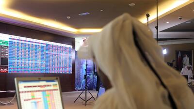 A Qatari trader at the stock exchange in Doha. All but one Qatari stocks have bombed. Stringer/AFP