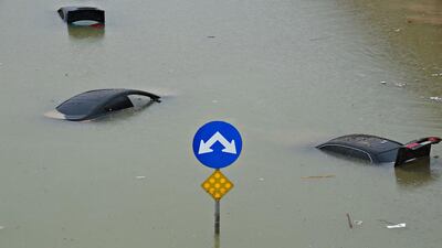 Vehicles under floodwater on a motorway in western Riyadh, Saudi Arabia. Fayez Nureldine / AFP Photo