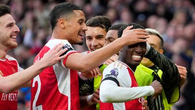 Arsenal's Eddie Nketiah, right, celebrates with teammates after scoring his side's second goal. AP