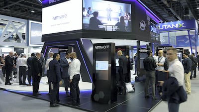 Visitors browse the Dell stand at Gitex Technology Week. Satish Kumar for The National