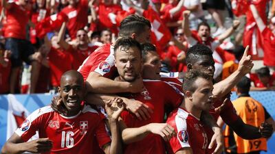Xherdan Shaqiri (celebrates with teammates after scoring the equalising goal. CJ Gunther / EPA