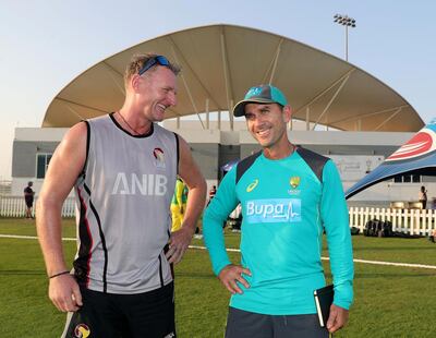 Abu Dhabi, United Arab Emirates - October 22, 2018: Head coaches Dougie Brown of UAE and Justin Langer Australia at the end of the match between the UAE and Australia in a T20 international. Monday, October 22nd, 2018 at Zayed cricket stadium oval, Abu Dhabi. Chris Whiteoak / The National