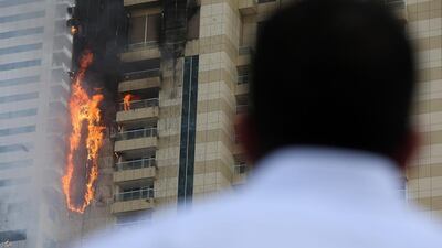 A Civil Defence crane fitted with a hose was used to fight flames on the lower floors.