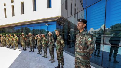 Fighters loyal to Libya's Tripoli-based Government of National Unity stand guard outside the headquarters of Libya's National Oil Corporation in the capital after the removal of its chairman, Mustafa Sanalla. AFP