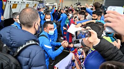 Xavi Hernandez signs autographs to fans at Sydney International Airport. AFP