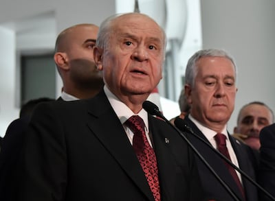 Devlet Bahceli, leader of Nationalist Movement Party, or MHP, and the main ally of Turkey's President Recep Tayyip Erdogan, speaks to the media at his party's headquarters in Ankara, Turkey, late Sunday, June 24, 2018. MHP Press Service via AP