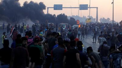 Demonstrators gather at a protest after the lifting of the curfew in Baghdad, Iraq. Reuters