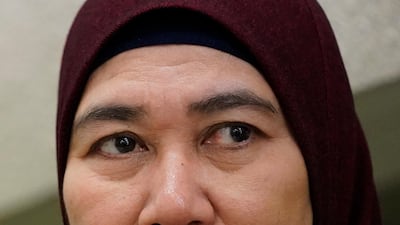 Munirah Mustafa, sister of MH17 flight attendant Mastura Mustafa, speaks to media in Kuala Lumpur, Malaysia on Tuesday, March 3, 2020. AP Photo