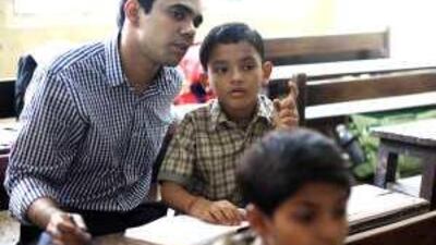 Rakesh Mani teaches subjects ranging from science to history to classes as large as 75 pupils at Umedbhai Patel English School.