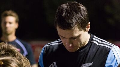 Ben Smith signs autographs for the juniors on Tuesday night. Duncan Chard for The National