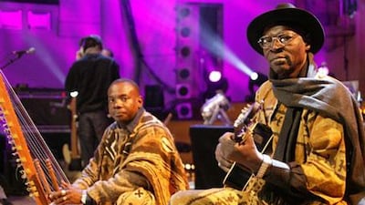 The Malian singer and guitarist Ali Farka Touré, right, and the kora master Toumani Diabaté perform in Brussels in 2005.