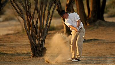 Spain's Gonzalo Fernandez-Castano plays a shot on the 3rd hole during the second day of the Dubai Desert Classic golf tournament on January 30, 2009. Sweden's Henrik Stenson grabbed the clubhouse lead at the Dubai Desert Classic but another lengthy fog delay meant that more than half the players failed to finish their second rounds. AFP PHOTO/MARWAN NAAMANI *** Local Caption *** 208966-01-08.jpg