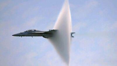 A ring of water vapour is created as an F/A-18F Super Hornet flies close to breaking the sound barrier. Christopher Pasatieri / Reuters