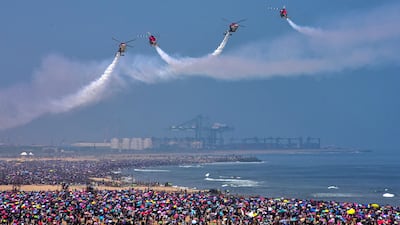 The Sarang Helicopter Display Team take part in the event in Chennai attended by more than 1.5 million people. EPA