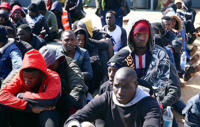 Rescued migrants aboard a Libyan coast guard vessel arrive at Tripoli naval base. AFP
