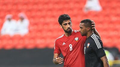 UAE's Hamdan Al Kamali consoles keeper Khalid Eisa after one of Uzbekistan's four goals in a 4-0 friendly win over the Emiratis in Abu Dhabi on Tuesday night. Ravindranath K / The National / October 14, 2014