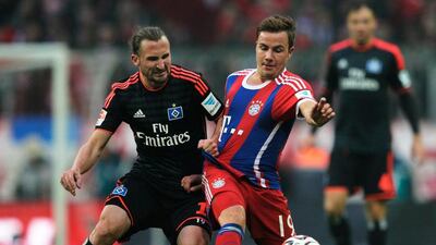 Mario Goetze of FC Bayern is challenged by Petr Jiracek of Hamburger SV during the Bundesliga match between FC Bayern Muenchen and Hamburger SV - at Allianz Arena on February 14, 2015 in Munich, Germany. (Photo by Adam Pretty/Bongarts/Getty Images)