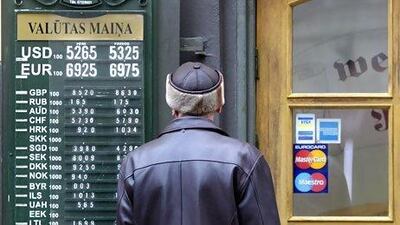 Currency rates are displayed near the exchange office in Riga. Latvia's economy grew by 5.5 per cent in 2011. Ints Kalnins / Reuters