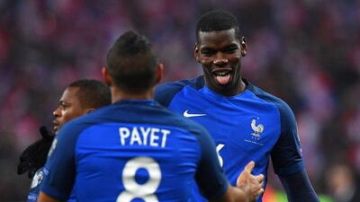 Paul Pogba, right, and Dimitri Payet were on target for France in the 2-0 win over Sweden. Franck Fife / AFP