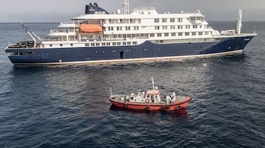 An ambulance boat approaches the MV Hondius off Praia, Cape Verde. AFP