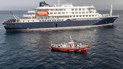An ambulance boat approaches the MV Hondius off Praia, Cape Verde. AFP