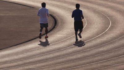 Manny Pacquiao goes for a jog with his younger brother Bobby in General Santos City, Philippines last year. Mike Young for The National / March 3, 2014