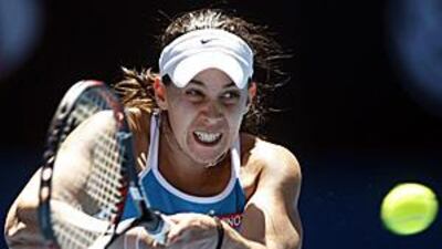 Marion Bartoli makes a return on her way to defeating Serbia's Jelena Jankovic.