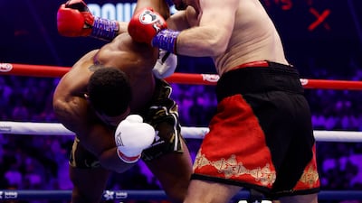 Kristian Prenga swarms all over Anthony Joshua during their heavyweight fight. Reuters