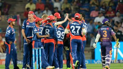 Delhi Daredevils players celebrate after the wicket of Rising Pune Supergiant batsman Ajinkya Rahane at The Maharashtra Cricket Association Stadium in Pune on April 11, 2017. Punit Paranjpe / AFP