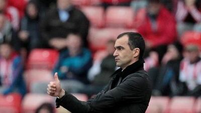 Everton's Spanish manager Roberto Martinez gestures from the touchline during an English Premier League football match. Everton visit Southampton on Saturday and Martinez will be short of players. AFP PHOTO/LINDSEY PARNABY