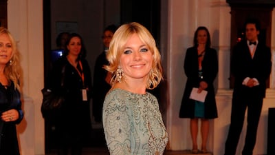 Sienna Miller, wearing Emanuel Ungaro, arrives at the British Academy Film Awards on February 11, 2006. EPA