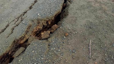 Debris lies strewn across a highway following a landslide near the town of Kainantu, following a 7.6-magnitude earthquake in north-eastern Papua New Guinea. All photos by AP